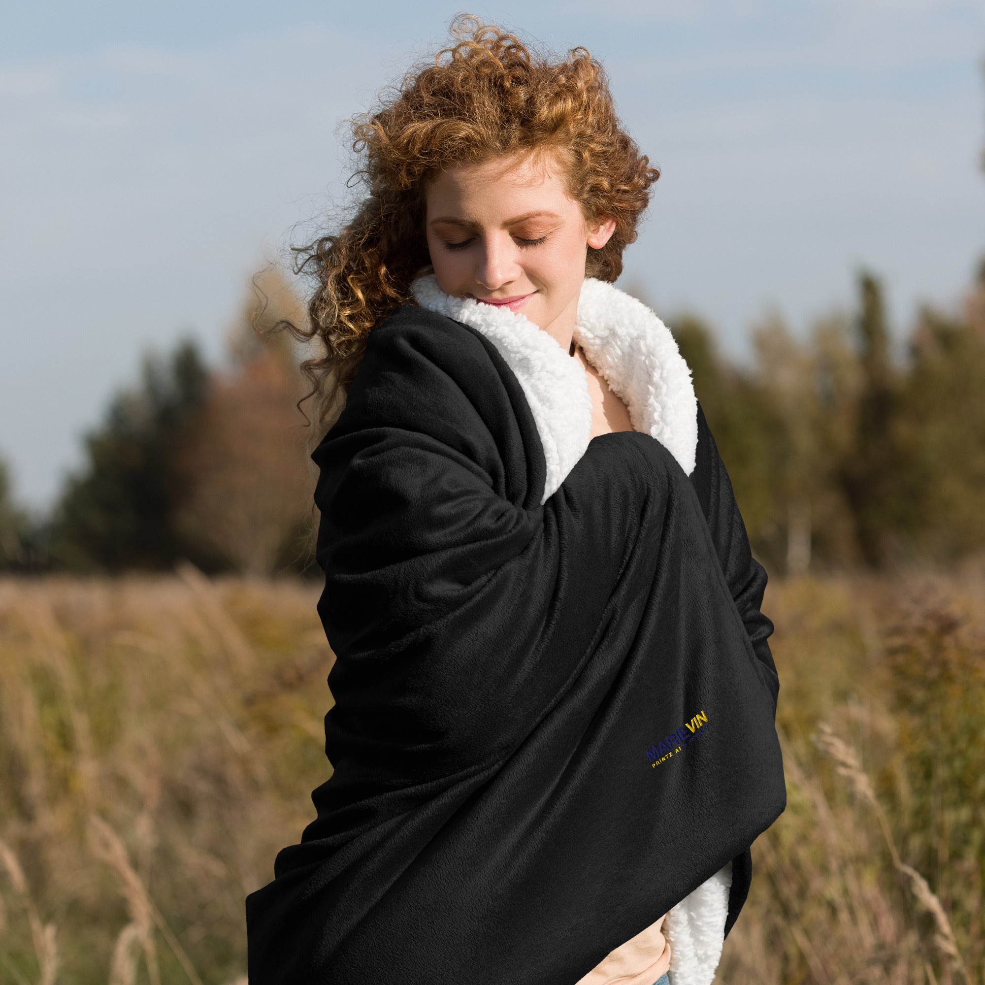 Stay warm with our Sherpa Blanket featuring soft fleece 