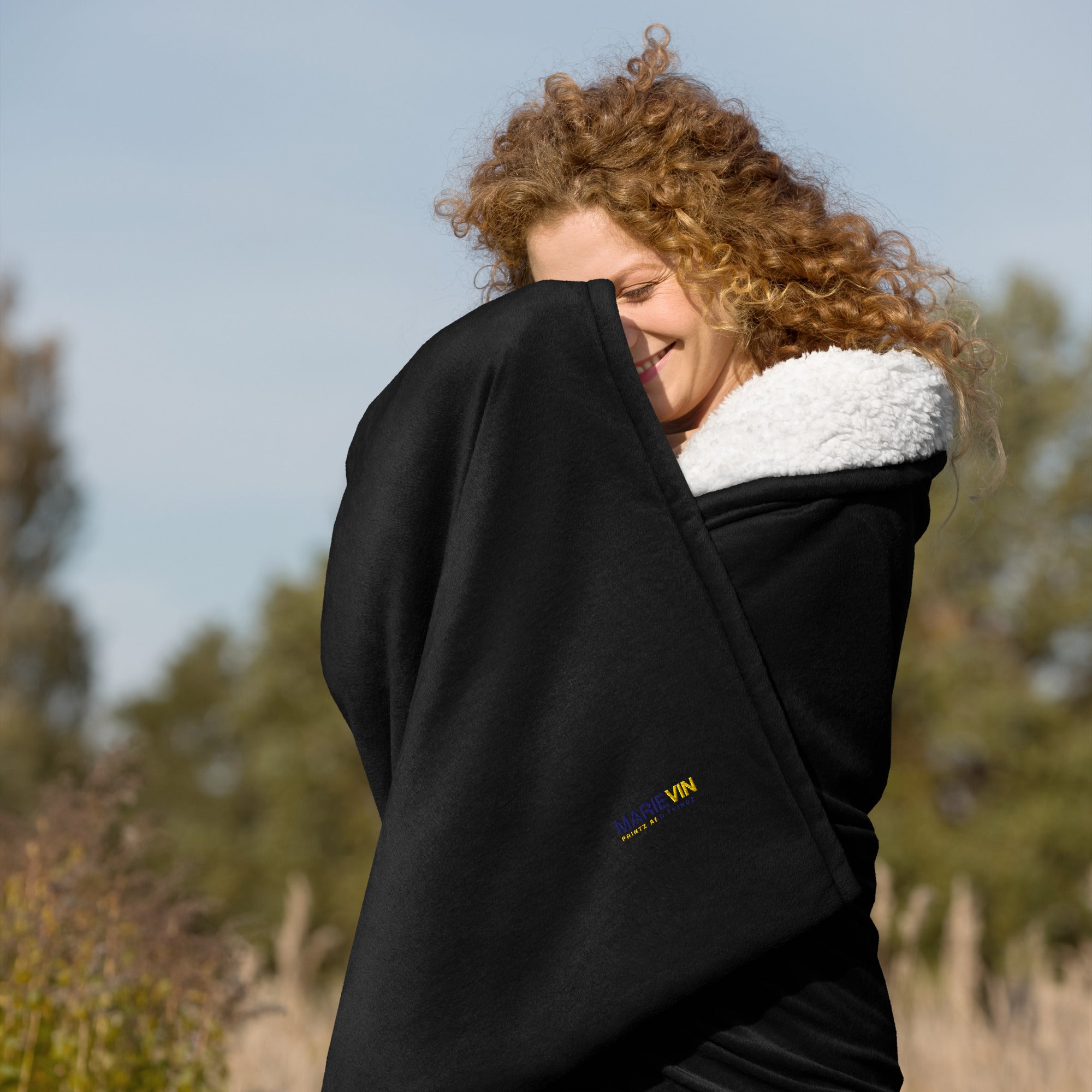 Stay warm with our Sherpa Blanket featuring soft fleece 