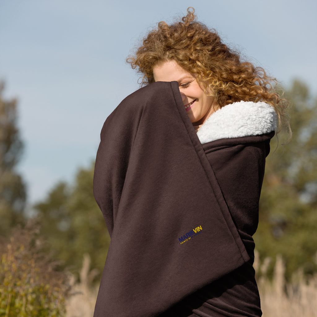 Stay warm with our Sherpa Blanket featuring soft fleece 