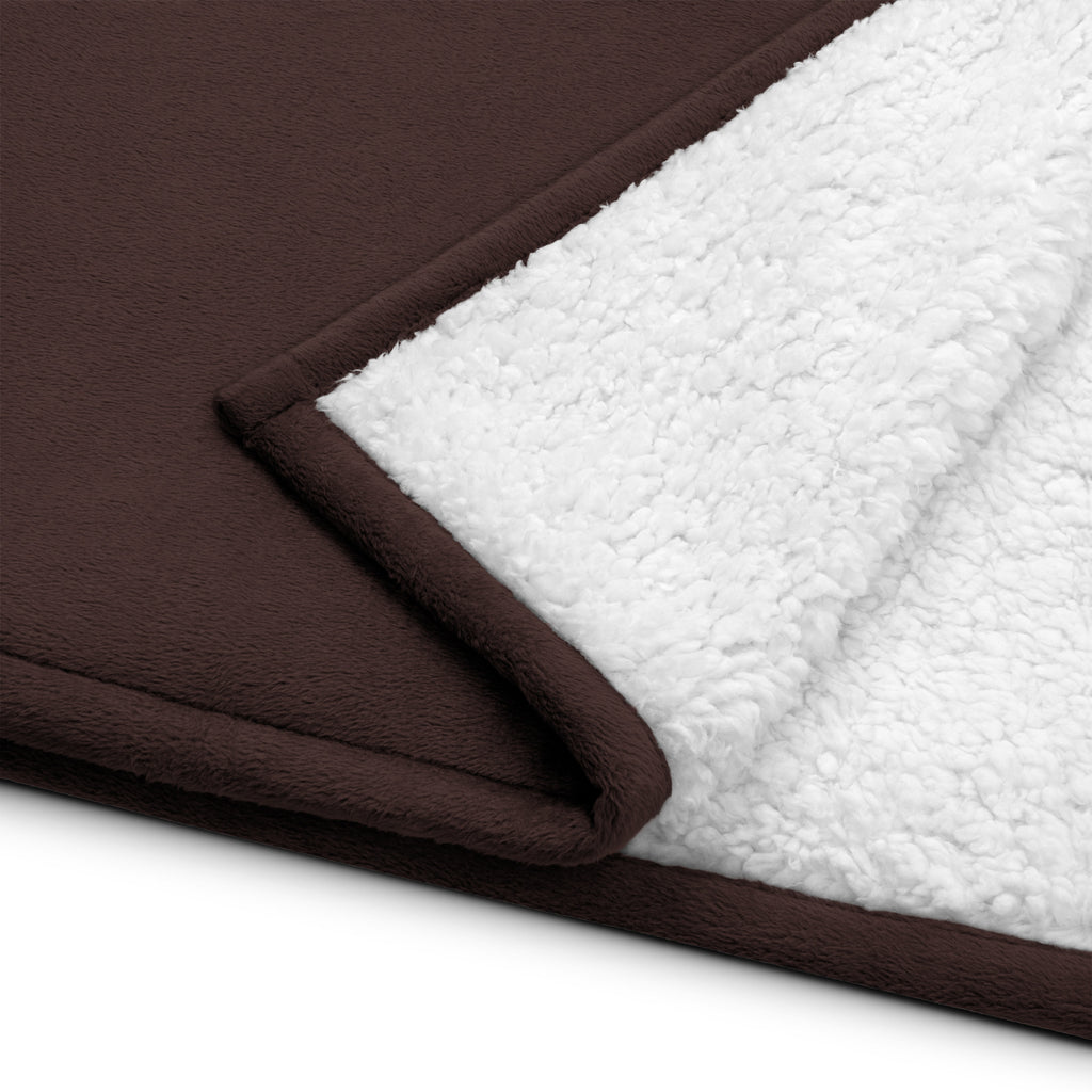 Stay warm with our Sherpa Blanket featuring soft fleece showcasing the luxurious brown and white texture.