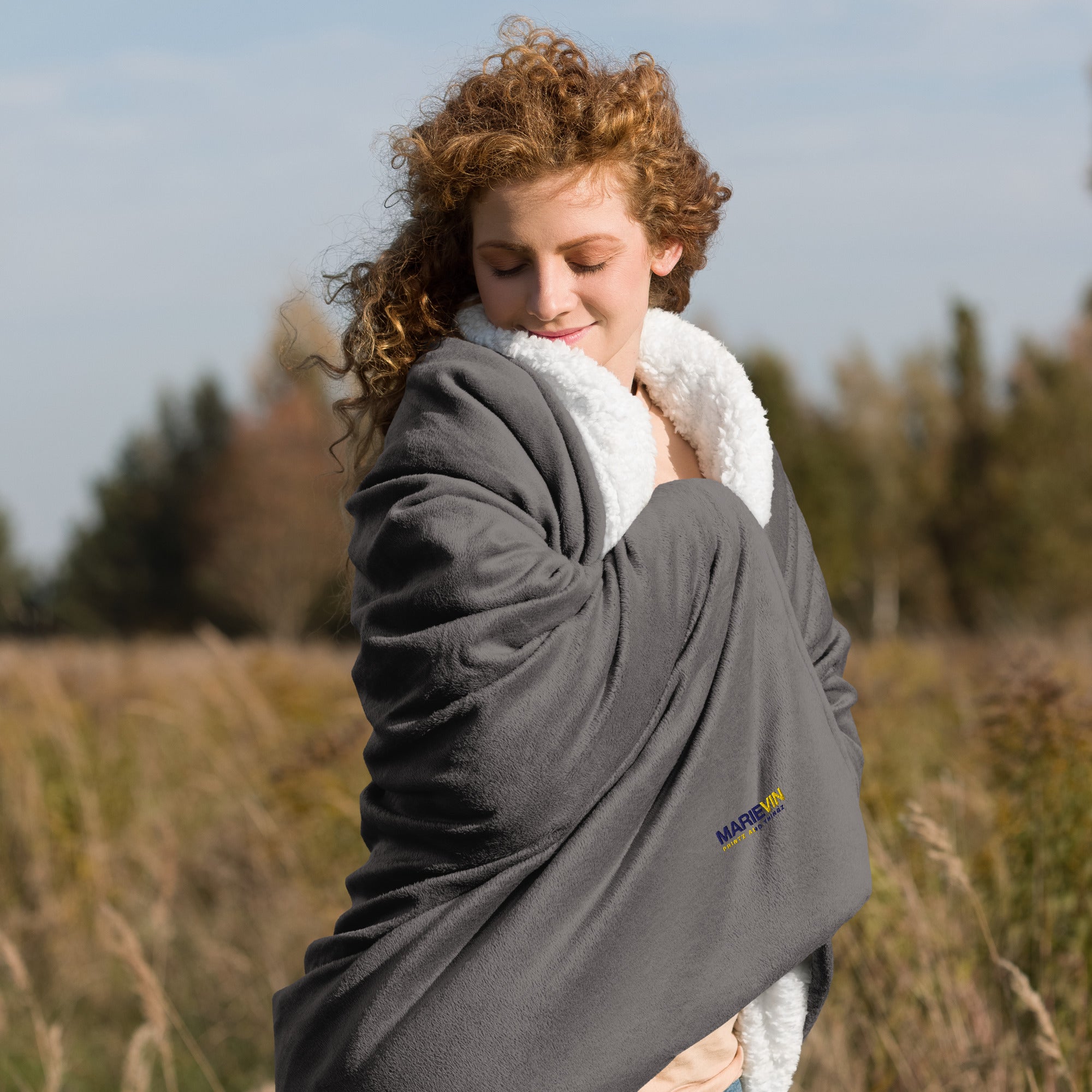 Stay warm with our Sherpa Blanket featuring soft fleece 