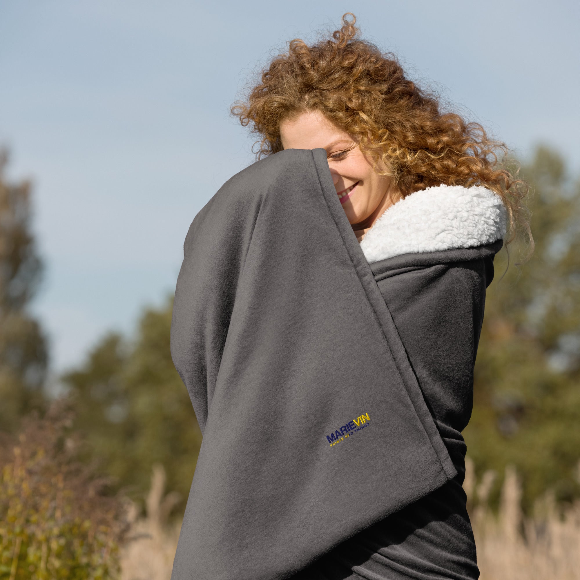 Stay warm with our Sherpa Blanket featuring soft fleece 