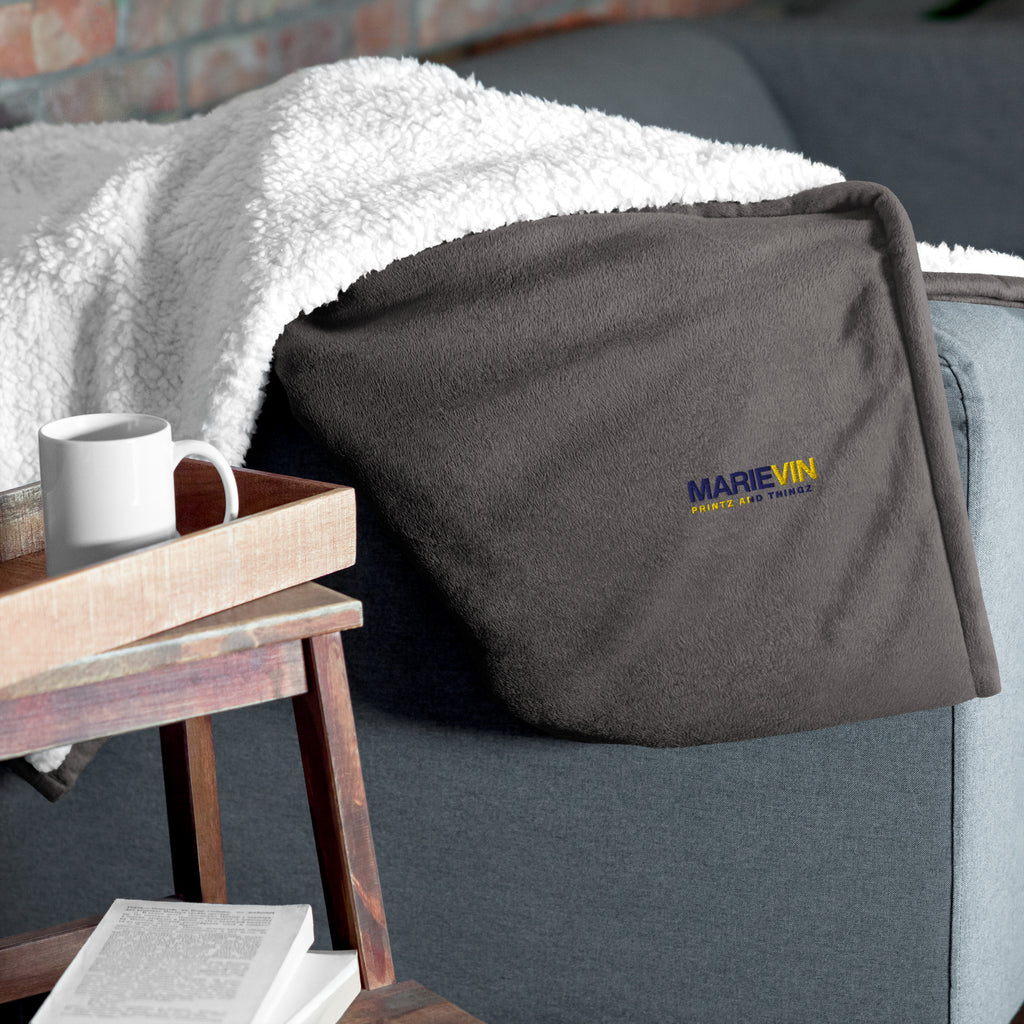 Stay warm with our Sherpa Blanket featuring soft fleece 